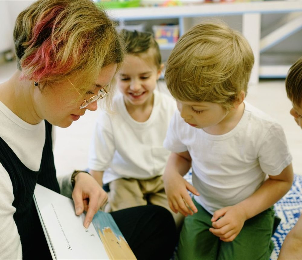 A teacher leading a small group activity